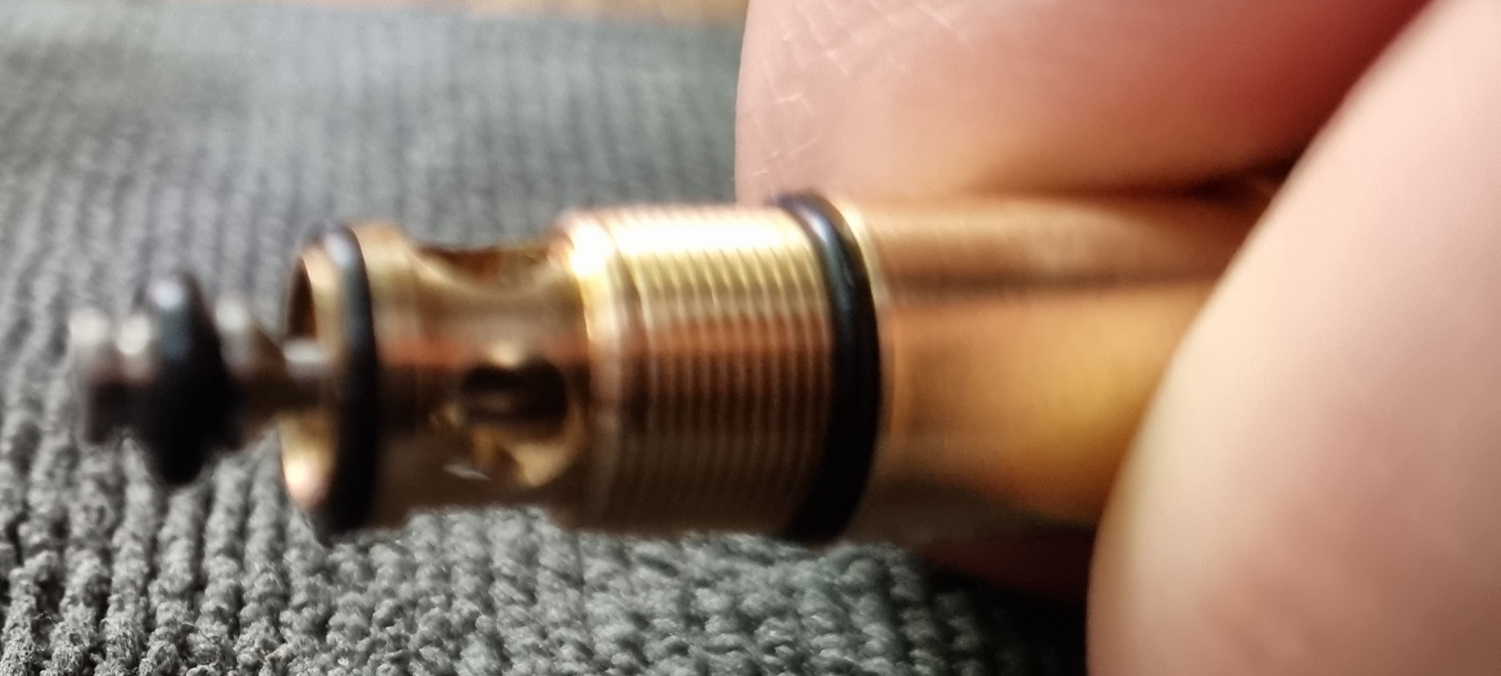 GHK Replacing The Valve Output O-Rings Guide: Push the silver post back through the brass shell